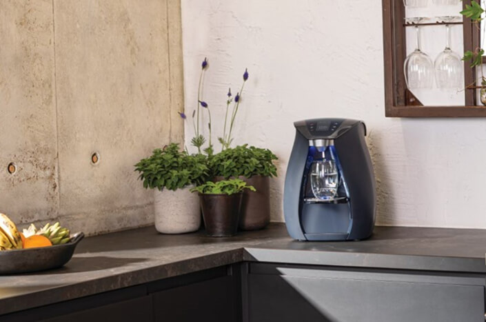 Modern water dispenser on kitchen counter