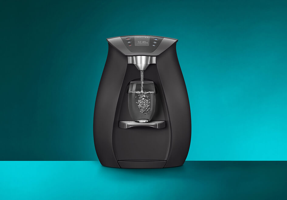 Black sparkling water machine pouring fizzy water.